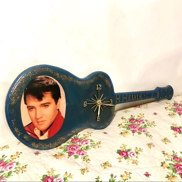 Elvis clock blue with glitter under coating. Works.